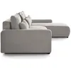 Side view of a light gray sectional sofa with corduroy texture and throw pillows. Produktbild-Vorschau