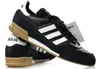 A pair of black Adidas Mundial Goal soccer shoes. Anteprima dell’immagine prodotto
