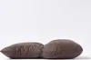 Two brown cushions are placed side-by-side on a white background. Náhled obrázku produktu