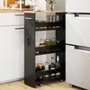 A narrow kitchen cart filled with jars and bottles is placed between a white cabinet and a stainless steel refrigerator. Podgląd zdjęcia produktu