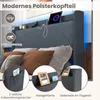 A close-up view of a modern upholstered bed frame with integrated features like LED lighting and storage. Anteprima dell’immagine prodotto