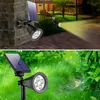 A collage of two images showing solar-powered LED spotlights in outdoor settings. Voir les images du produit