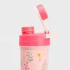 Close-up of the top part of a pink water bottle with a floral pattern. The lid is open, showing the drinking spout mechanism. Podgląd zdjęcia produktu