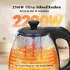 Close-up of a glass kettle with water boiling, showing heating elements and steam, with promotional text overlaid. Produktbild-Vorschau