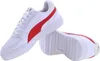A pair of white Puma sneakers with red accents. Produktbild-Vorschau