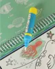 A close-up of a water coloring book with a water pen and illustrations of sea creatures. Podgląd zdjęcia produktu