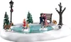 A miniature Christmas village scene depicting people ice skating on a pond. Produktbild-Vorschau