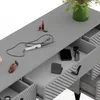 A close-up view of a gray vanity table with drawers, showing a curling iron, sunglasses, and makeup. Podgląd zdjęcia produktu