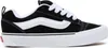 A side view of a black and white Vans sneaker. Voir les images du produit