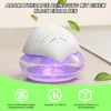 A close-up of a white and purple air purifier with green leaves and text overlays. Produktbild-Vorschau