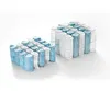 Two blocks of pocket springs, one smaller than the other, are arranged on a white background. The springs are individually wrapped in fabric, with some in blue and others in white. Produktbild-Vorschau