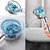 A collage of images showing a shower head with a spinning turbine, water spraying from it, and a hand holding it over a bathtub. Produktbild-Vorschau