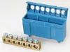 A blue terminal block and a brass terminal bar with screws are shown on a white background. Produktbild-Vorschau