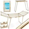 A collage of images showing a foldable drying rack in different configurations and a close-up of its packaging. Produktbild-Vorschau
