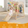 Two children playing on a wooden indoor climbing frame with a slide and net. Produktbild-Vorschau