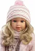 Close-up studio portrait of a doll wearing winter clothing. Anteprima dell’immagine prodotto