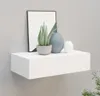 A white floating shelf mounted on a gray wall, decorated with a framed picture, a potted succulent plant, and two decorative vases. Produktbild-Vorschau