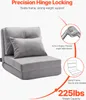 A gray convertible floor sofa with a pillow, shown with diagrams highlighting its features. Voir les images du produit