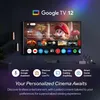 A smart TV displaying the Google TV interface with various app icons and a movie poster, set in a modern living room. Produktbild-Vorschau
