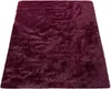 A fluffy, shaggy rug in a deep purple color is shown from a top-down perspective on a white background. Voir les images du produit