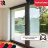 A modern sliding glass door with a view of a garden. Anteprima dell’immagine prodotto