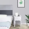 A bedroom scene with a bed and a nightstand. Produktbild-Vorschau