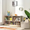 A child's room with a toy shelf filled with toys, books, and stuffed animals. A small child's chair is in the foreground. Podgląd zdjęcia produktu