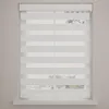 A white roller blind with horizontal stripes of sheer and opaque fabric, covering a window. Produktbild-Vorschau