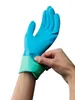 A person is putting on a blue and green glove. Náhľad obrázku produktu