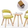 A small wooden table with two chairs, styled with a modern, minimalist aesthetic. Produktbild-Vorschau