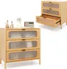 A product shot of a wooden chest of drawers with three drawers, one of which is open, and a small radio and decorative items on top. A second, smaller image of the same chest of drawers is in the upper right corner. Podgląd zdjęcia produktu