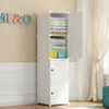 A white modular closet filled with folded clothes and storage baskets, standing against a cream-colored wall with decorative letters. Náhled obrázku produktu