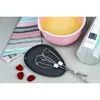 A kitchen scene with a hand mixer, mixing bowl, and a towel. Produktbild-Vorschau