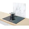 A glass stove splashback with a marble pattern is placed behind a pot on a glass ceramic hob. Anteprima dell’immagine prodotto