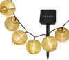A string of solar-powered lantern lights with a solar panel. Produktbild-Vorschau