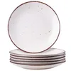 A stack of white plates with a speckled brown design around the rim, set against a white background. Náhled obrázku produktu
