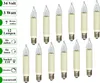 A collection of small, candle-shaped light bulbs with cream-colored bases and clear glass tops, arranged in rows on a white background. Text labels are present on the left side of the image. Produktbild-Vorschau