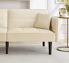 A close-up view of a beige sofa with a pillow on it, placed on a striped rug. Voir les images du produit