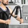 A man is using a SPORTNOW Power Twister arm trainer. Náhľad obrázku produktu