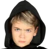 Close-up of a child's face wearing a black hood. Produktbild-Vorschau