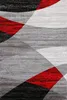 A close-up view of a rug with a geometric pattern. Voir les images du produit