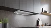 A modern kitchen with a stainless steel range hood installed under dark gray cabinets. Voir les images du produit