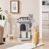 Two cats interacting with a cat tree in a living room setting. Podgląd zdjęcia produktu