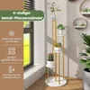 A multi-tiered plant stand with plants displayed in a bright, indoor setting near a window. Náhled obrázku produktu