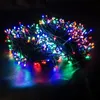 A tangled string of multi-colored LED lights on a dark background. Produktbild-Vorschau