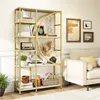 A gold and white bookshelf filled with decorative items and books, placed in a living room next to a sofa. Náhľad obrázku produktu