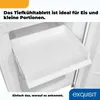 A close-up view of an empty white freezer drawer with text overlays. Produktbild-Vorschau