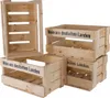 Several wooden crates are stacked and arranged against a white background. Produktbild-Vorschau