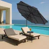 Two lounge chairs and a small table are set up on a patio next to a swimming pool, with the ocean in the background. Produktbild-Vorschau