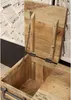 A close-up view of an open wooden chest with a chain attached to the lid. Produktbild-Vorschau